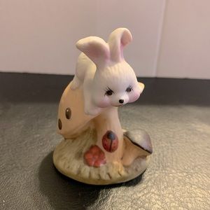 Cute Bunny rabbit on a mushroom